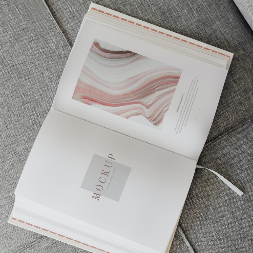 pastel open book on a sofa